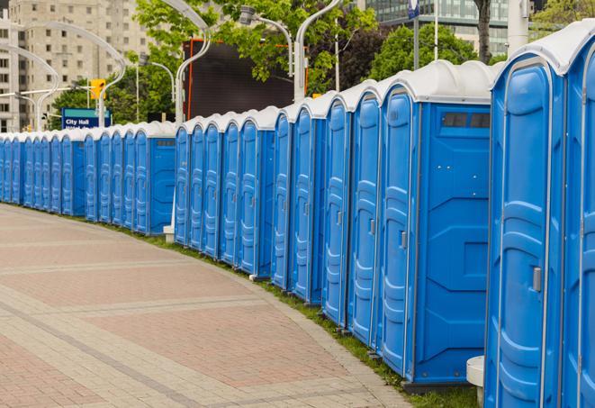 a row of portable restrooms set up for a special event, providing guests with a comfortable and sanitary option in Lafayette